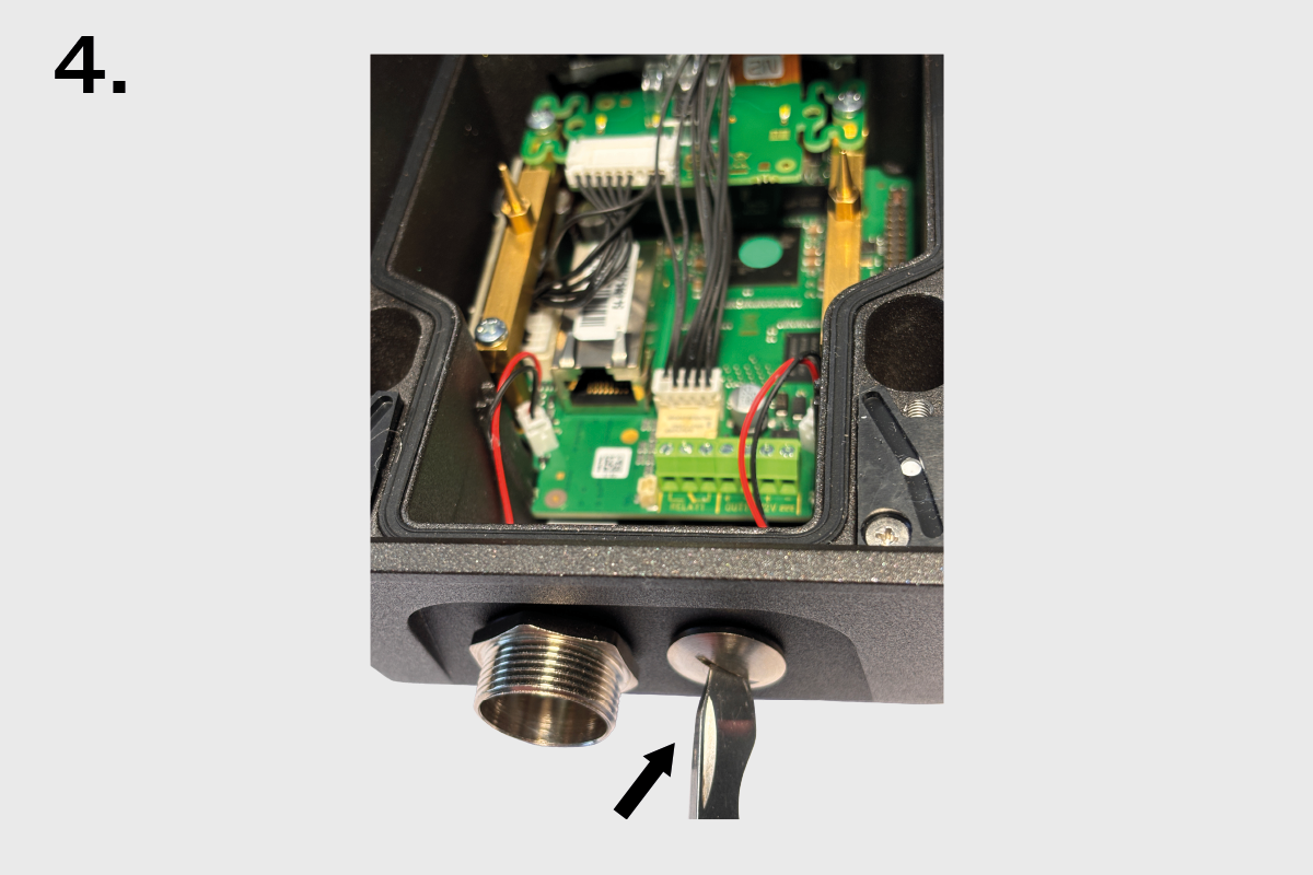 Cable Gland Pass-Through for IP Force – Side view with screwdriver removing cable entry plug